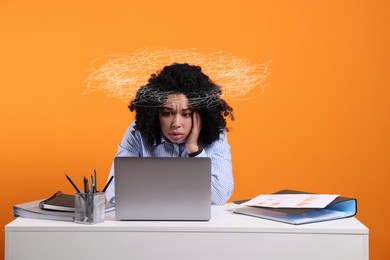 Image of Worried woman looking at laptop at desk against orange background. Confused thoughts as doodles around her head. Overworked, stress, anxiety