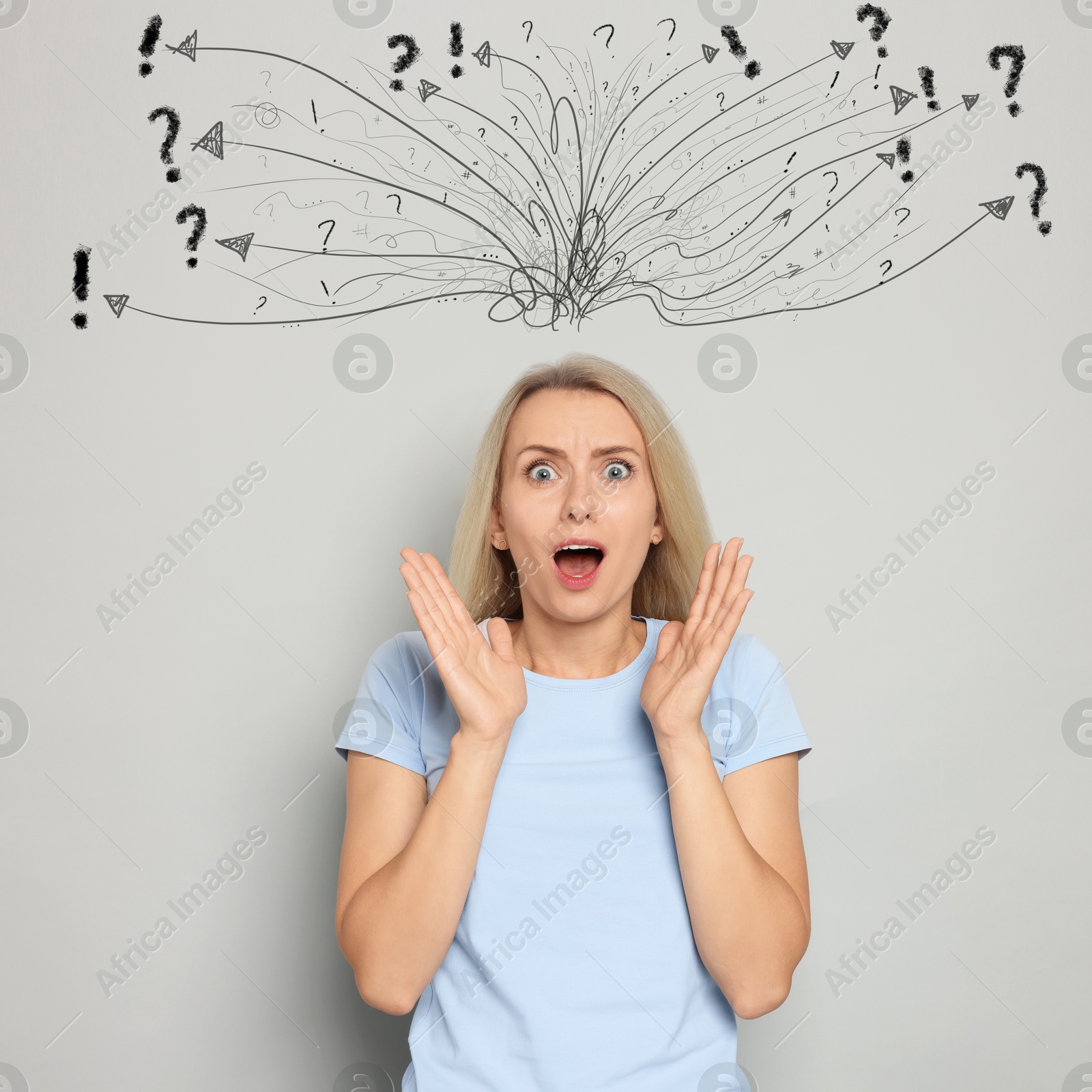 Shocked woman on light grey background. Confused thoughts as doodles above her head. Stress, anxiety, depression Image of Shocked woman on light grey background. Confused thoughts as doodles above her head. Stress, anxiety, depression