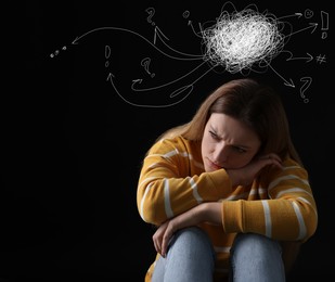 Image of Worried woman on black background. Confused thoughts as doodles above her head. Stress, anxiety, depression