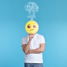 Illustration of Man covering his face with thinking emoticon on light blue background. Confused thoughts as explosion above his head. Stress, anxiety, depression