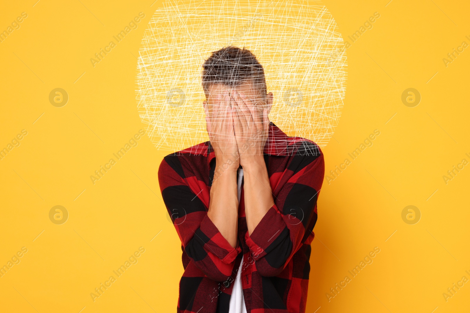 Image of Worried man covering his eyes on orange background. Confused thoughts as messy lines around his head. Stress, anxiety, depression