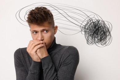Image of Worried man on white background. Confused thoughts as doodles around his head. Stress, anxiety, depression