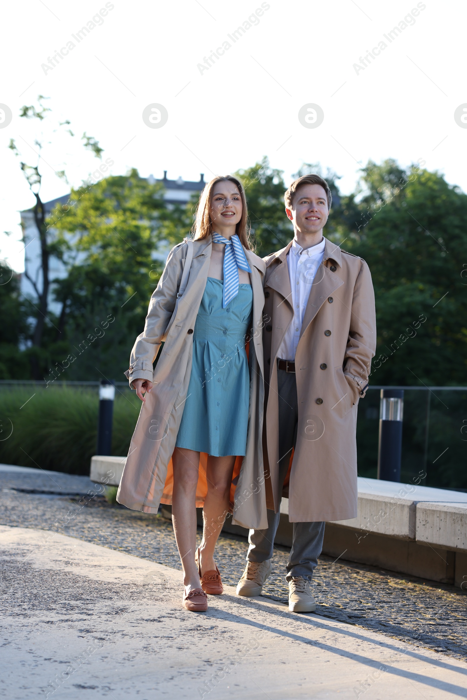 Lovely couple walking together on city street Photo of Lovely couple walking together on city street