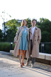 Photo of Lovely couple walking together on city street