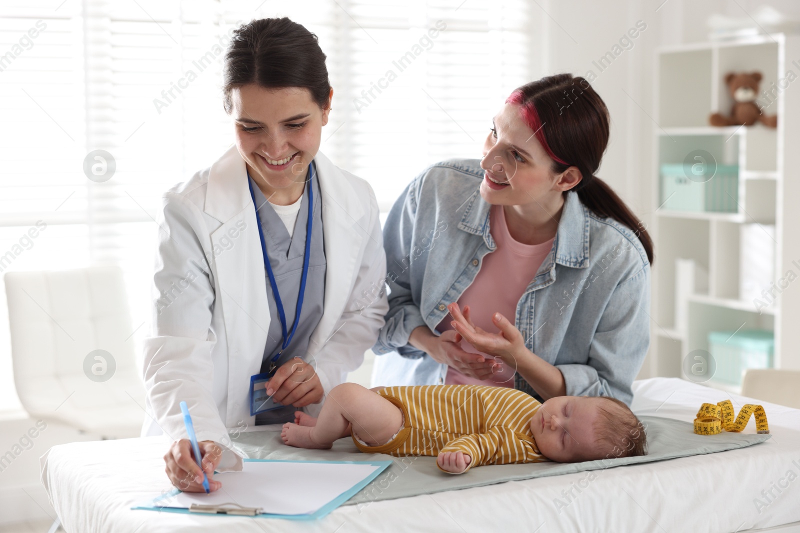Mother and her cute baby having appointment with pediatrician in hospital Photo of Mother and her cute baby having appointment with pediatrician in hospital