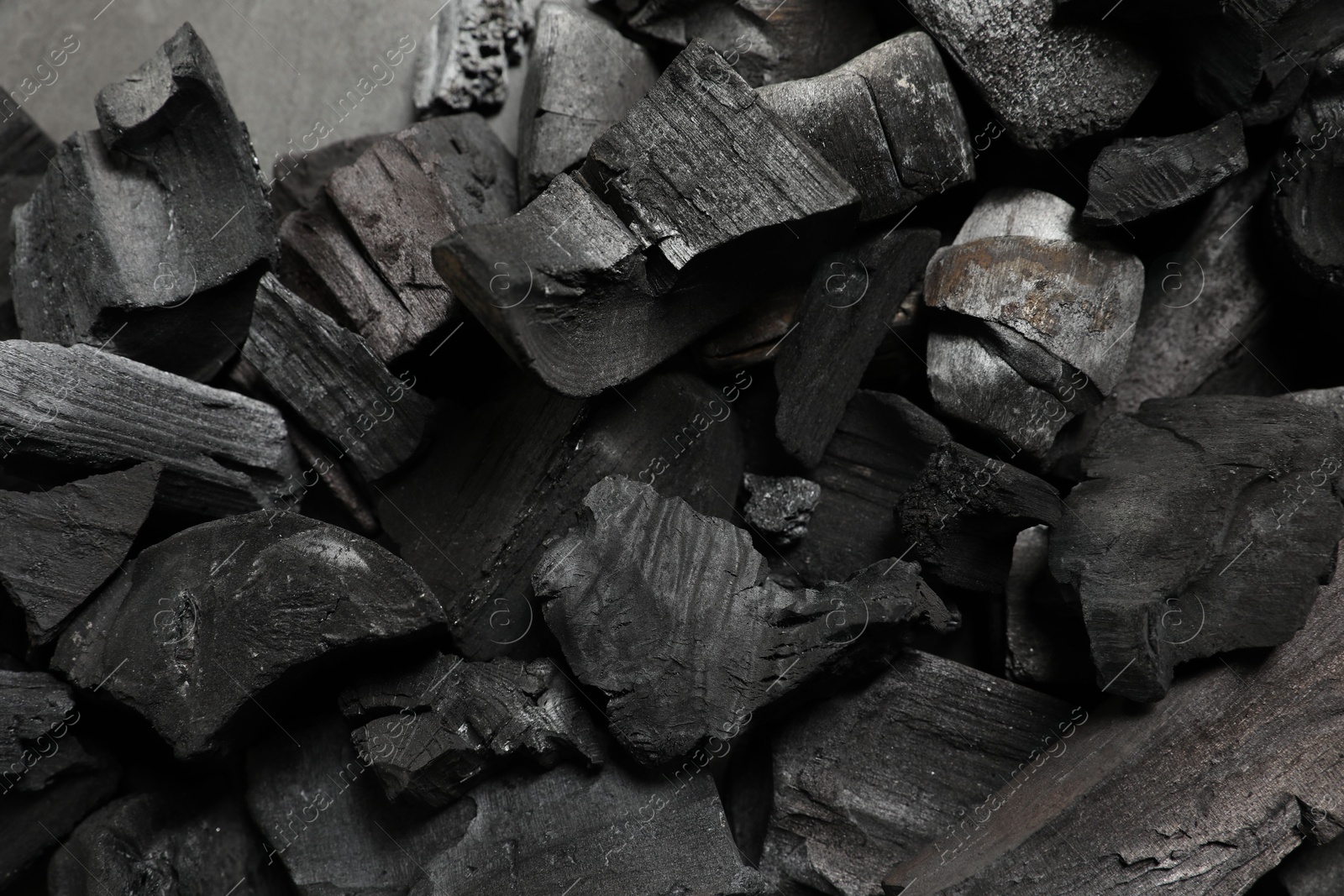 Pieces of black coals as background, top view Photo of Pieces of black coals as background, top view