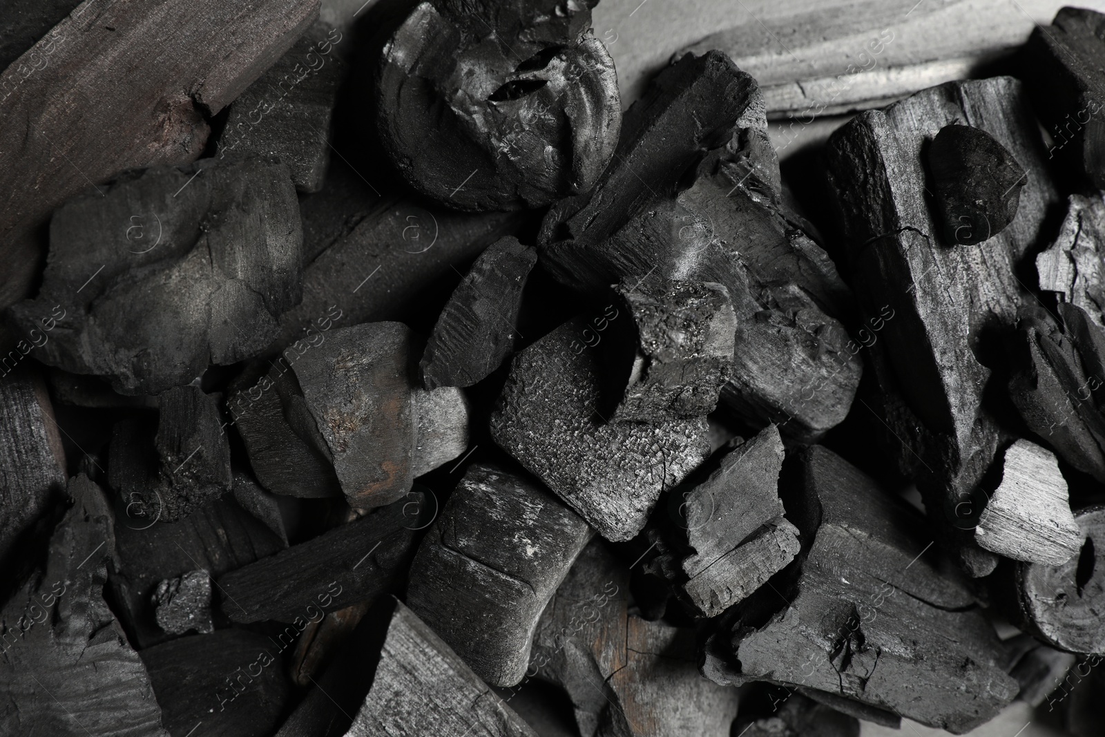 Pieces of black coals as background, top view Photo of Pieces of black coals as background, top view