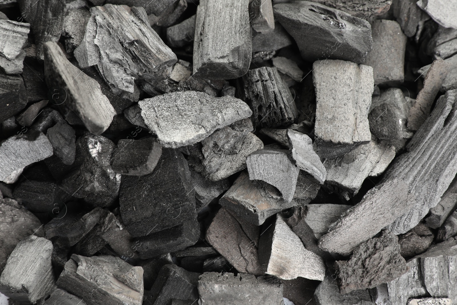 Pieces of black coals as background, top view Photo of Pieces of black coals as background, top view