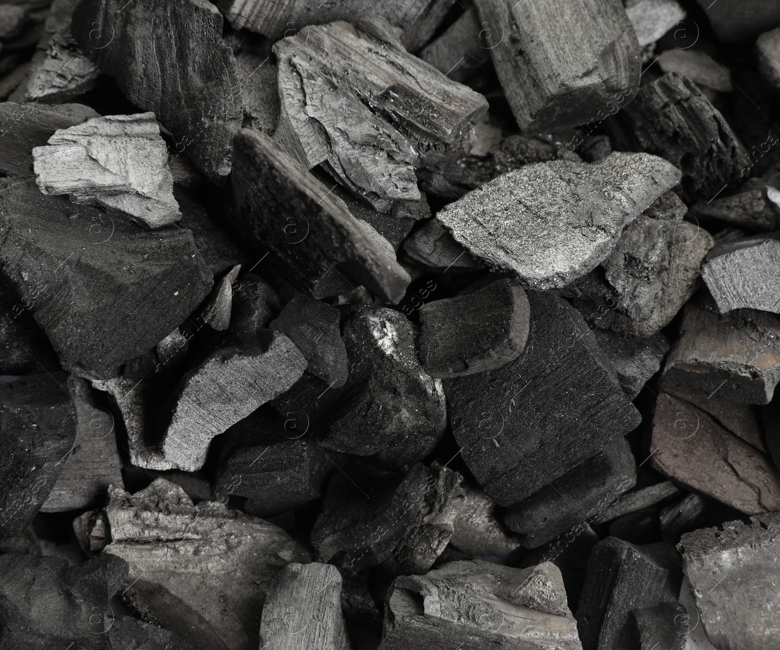 Pieces of black coals as background, top view Photo of Pieces of black coals as background, top view