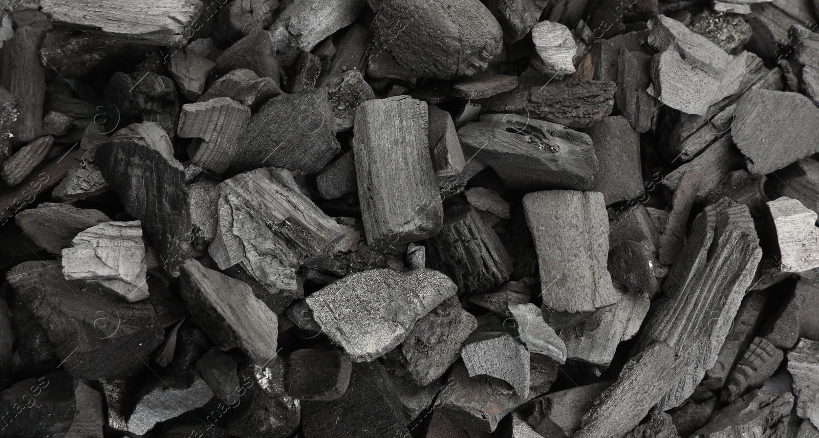 Pieces of black coals as background, top view Photo of Pieces of black coals as background, top view