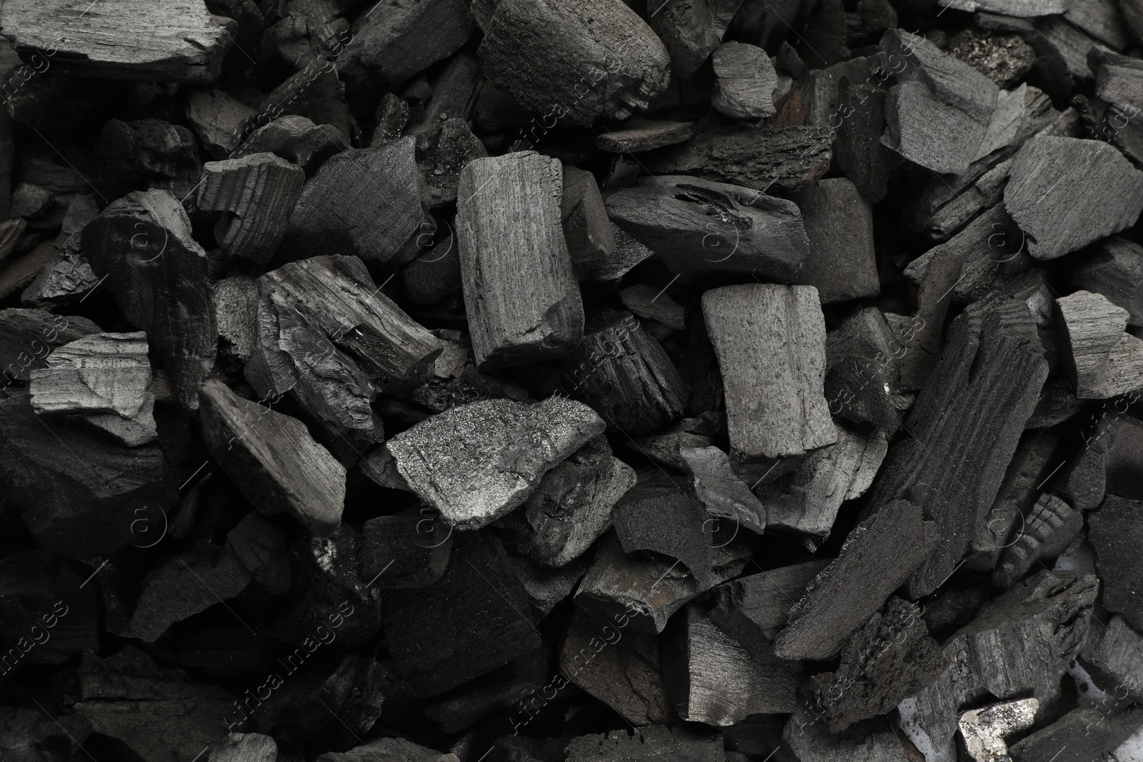 Pieces of black coals as background, top view Photo of Pieces of black coals as background, top view