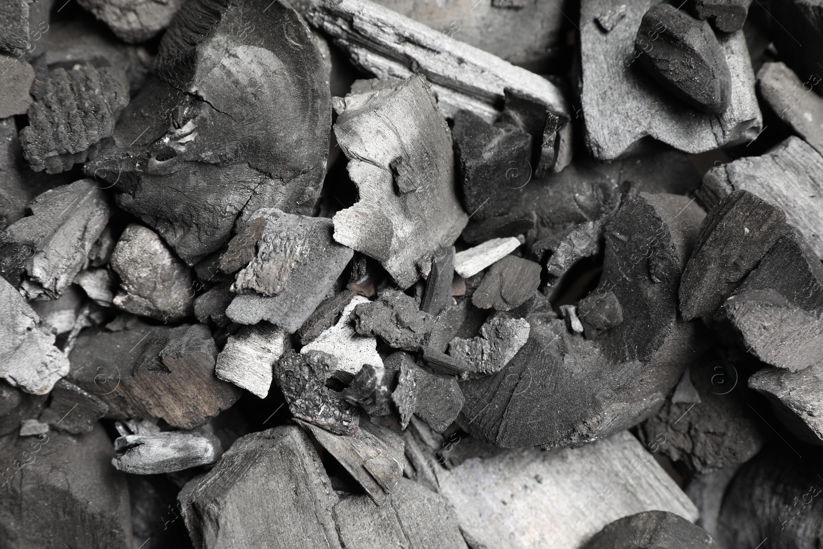Pieces of black coals as background, top view Photo of Pieces of black coals as background, top view