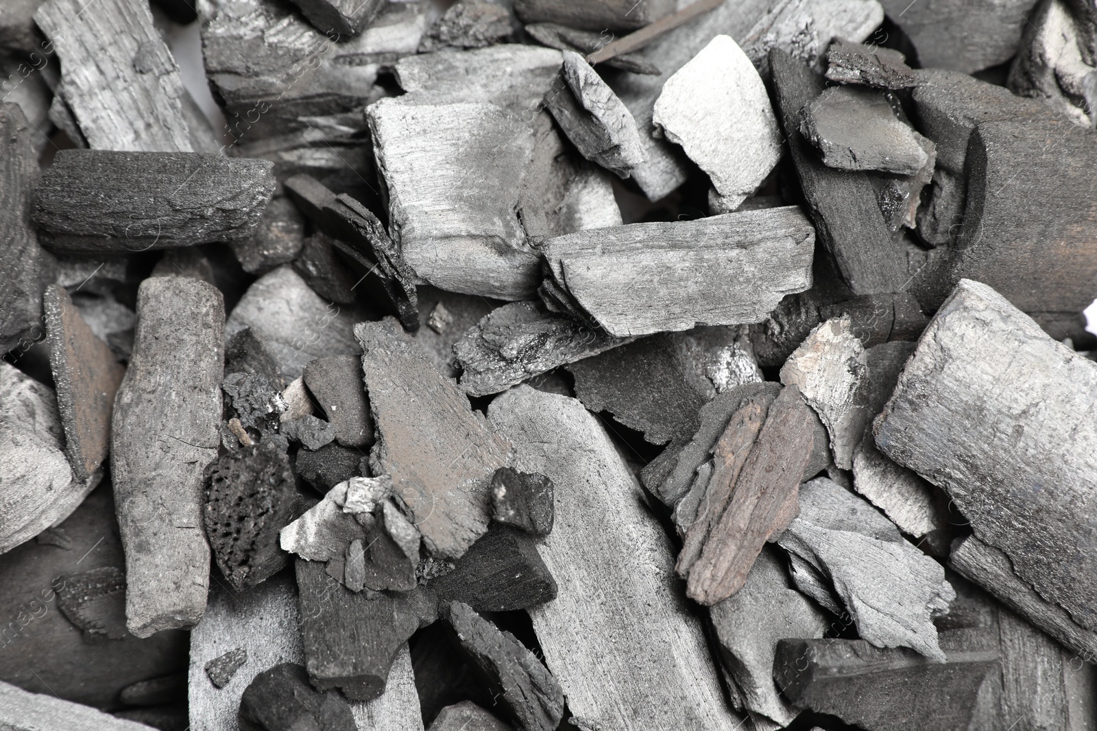 Pieces of black coals as background, top view Photo of Pieces of black coals as background, top view
