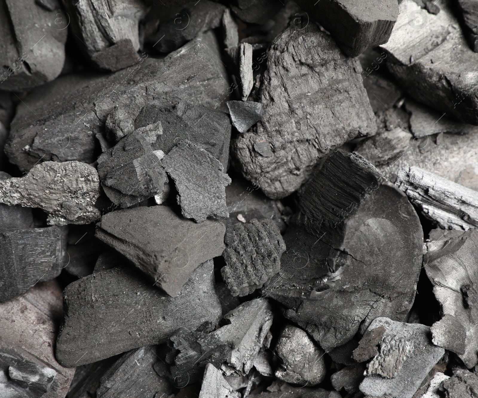 Pieces of black coals as background, top view Photo of Pieces of black coals as background, top view