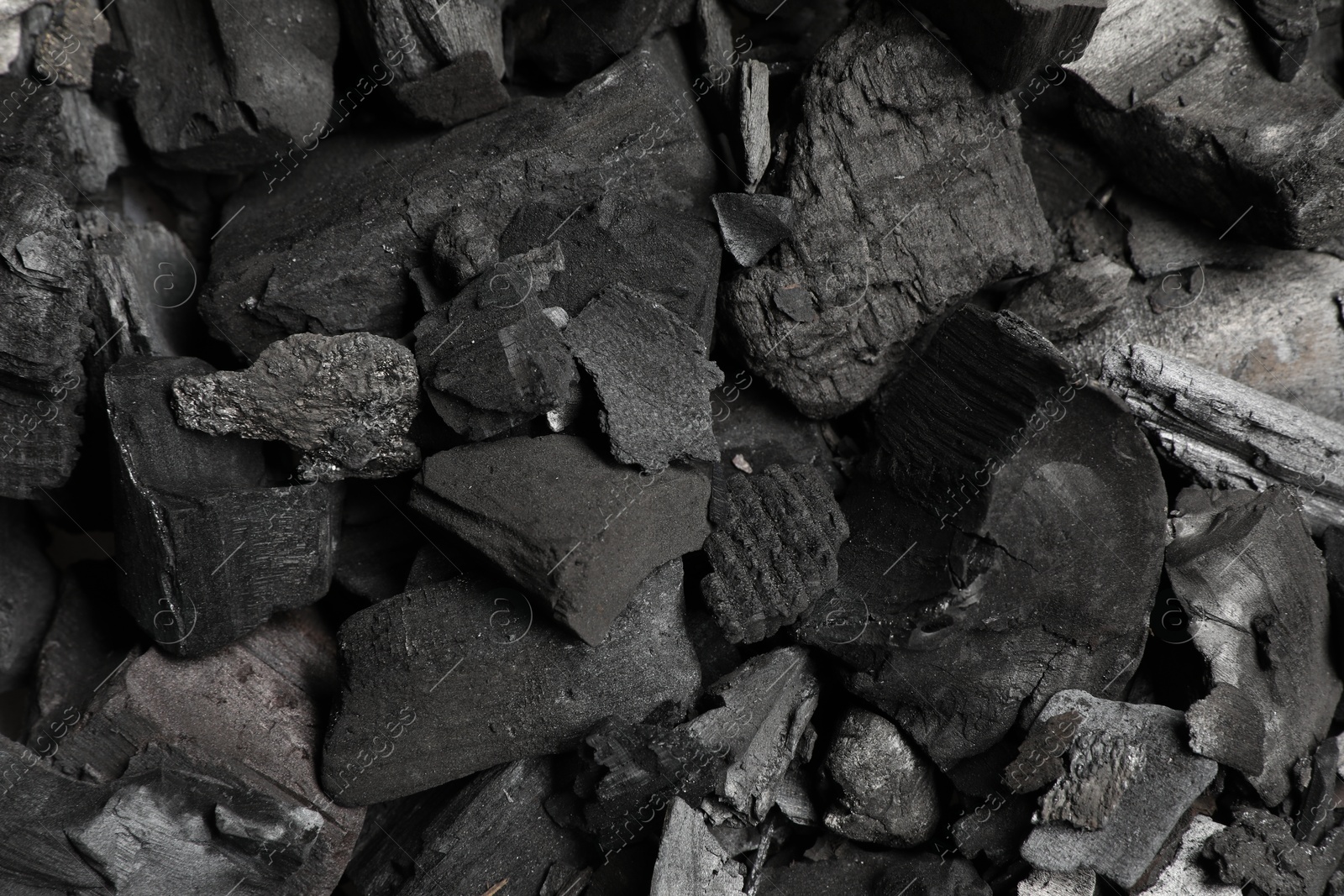 Pieces of black coals as background, top view Photo of Pieces of black coals as background, top view