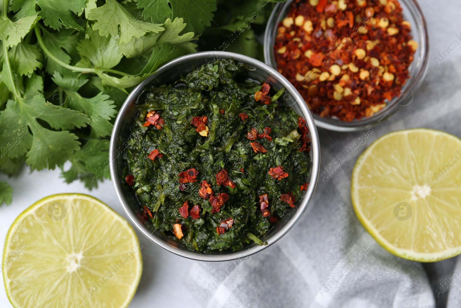 Tasty sauce with cilantro and other ingredients on table, flat lay Photo of Tasty sauce with cilantro and other ingredients on table, flat lay
