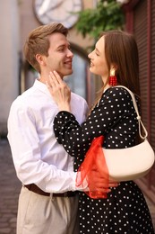 Photo of Lovely couple walking together on city street
