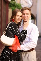 Photo of Lovely couple walking together on city street