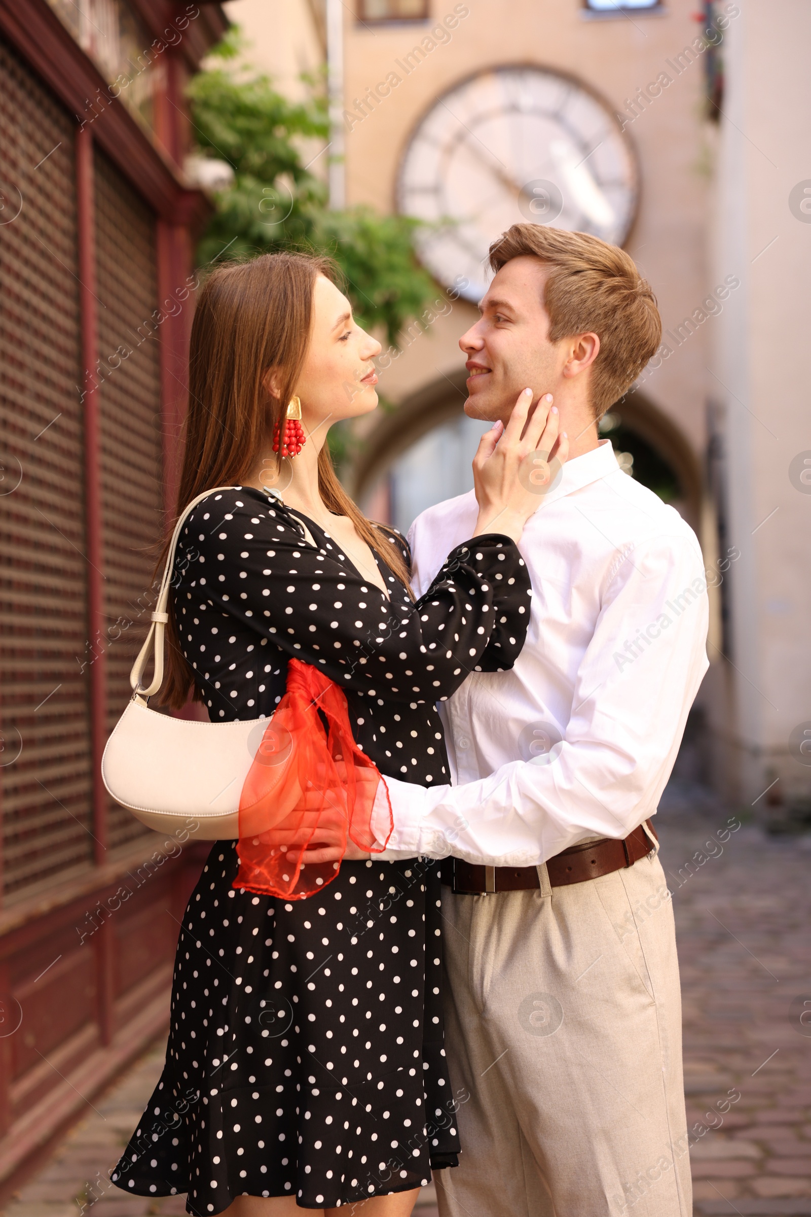 Lovely couple walking together on city street Photo of Lovely couple walking together on city street