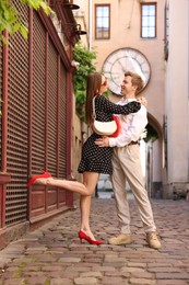 Photo of Lovely couple walking together on city street