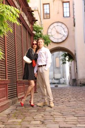 Photo of Lovely couple walking together on city street