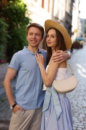 Photo of Lovely couple walking together on city street