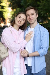 Photo of Lovely couple walking together on city street