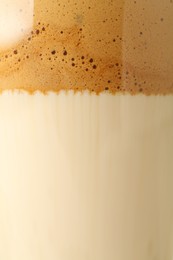 Photo of Delicious dalgona coffee in glass cup as background, closeup
