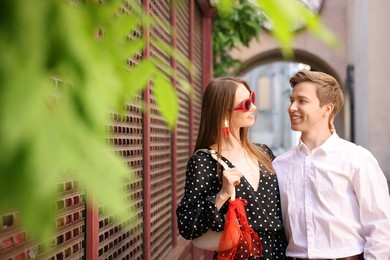 Photo of Lovely couple walking together on city street