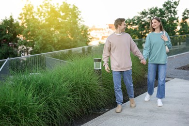 Photo of Lovely couple walking together on city street