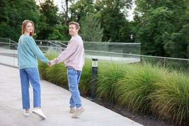 Photo of Lovely couple walking together on city street
