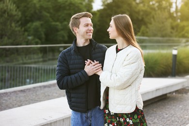 Photo of Lovely couple walking together on city street