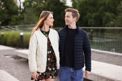 Photo of Lovely couple walking together on city street