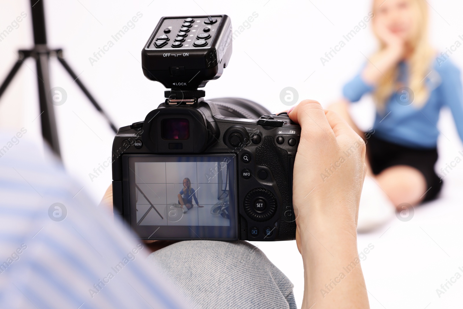 Photographer working with model in professional photo studio, selective focus Photo of Photographer working with model in professional photo studio, selective focus