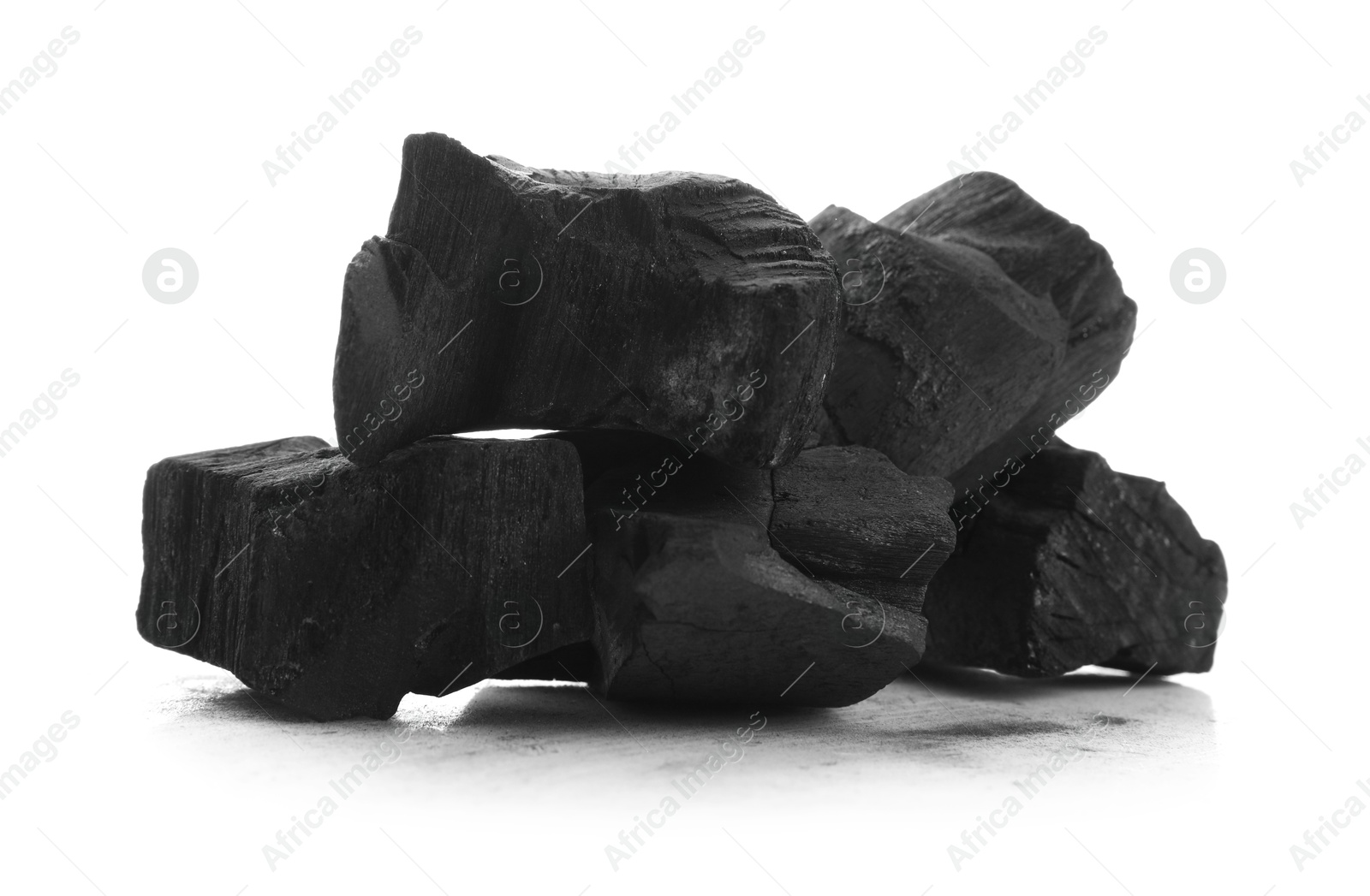 Pieces of black coals isolated on white Photo of Pieces of black coals isolated on white