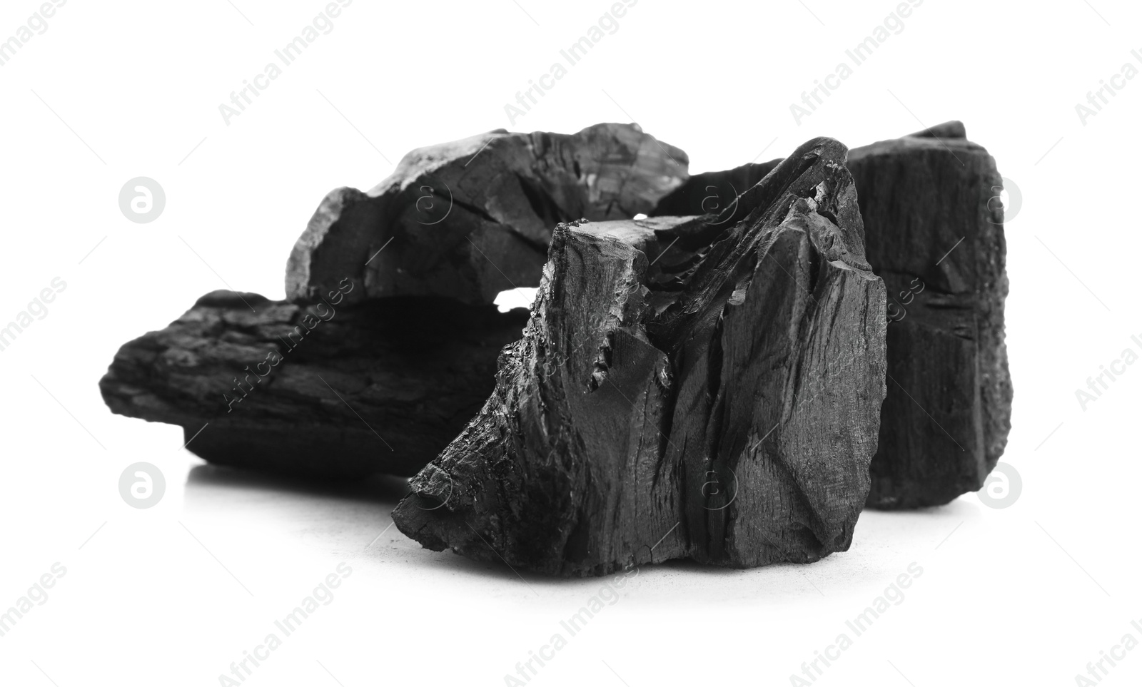 Pieces of black coals isolated on white Photo of Pieces of black coals isolated on white