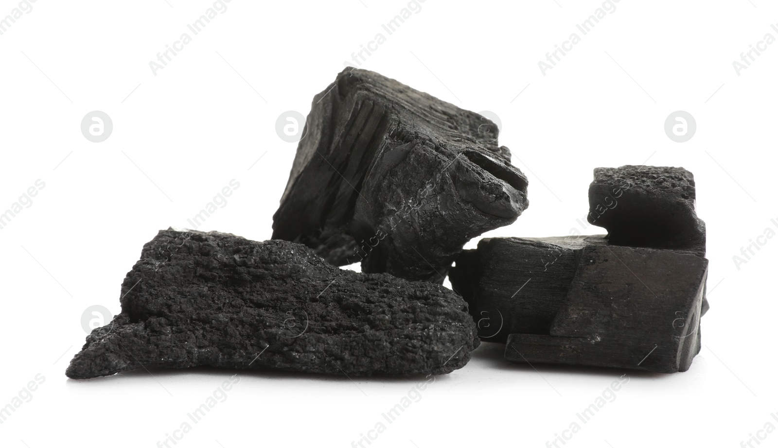 Pieces of black coals isolated on white Photo of Pieces of black coals isolated on white