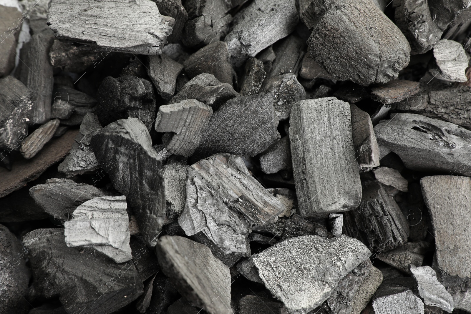 Pieces of black coals as background, top view Photo of Pieces of black coals as background, top view