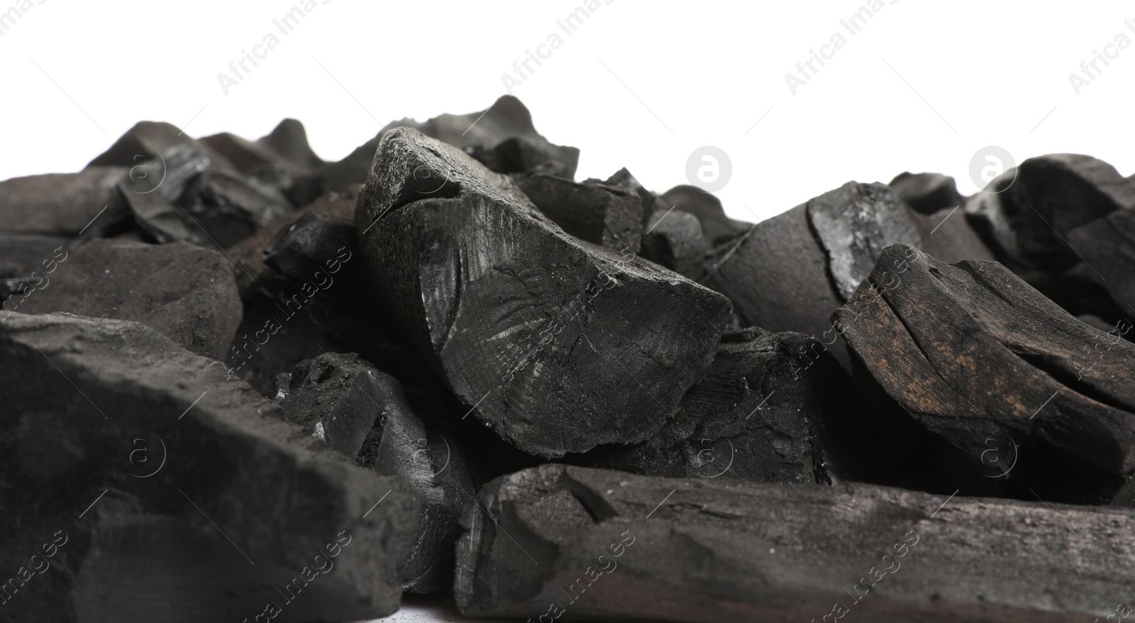 Pieces of black coals isolated on white Photo of Pieces of black coals isolated on white