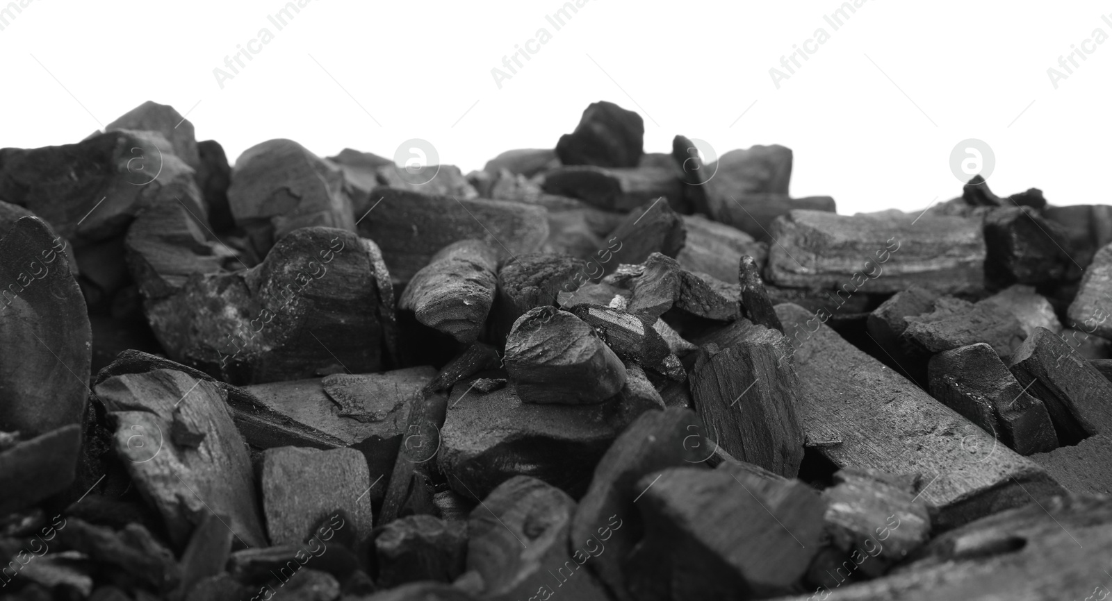 Pieces of black coals isolated on white Photo of Pieces of black coals isolated on white