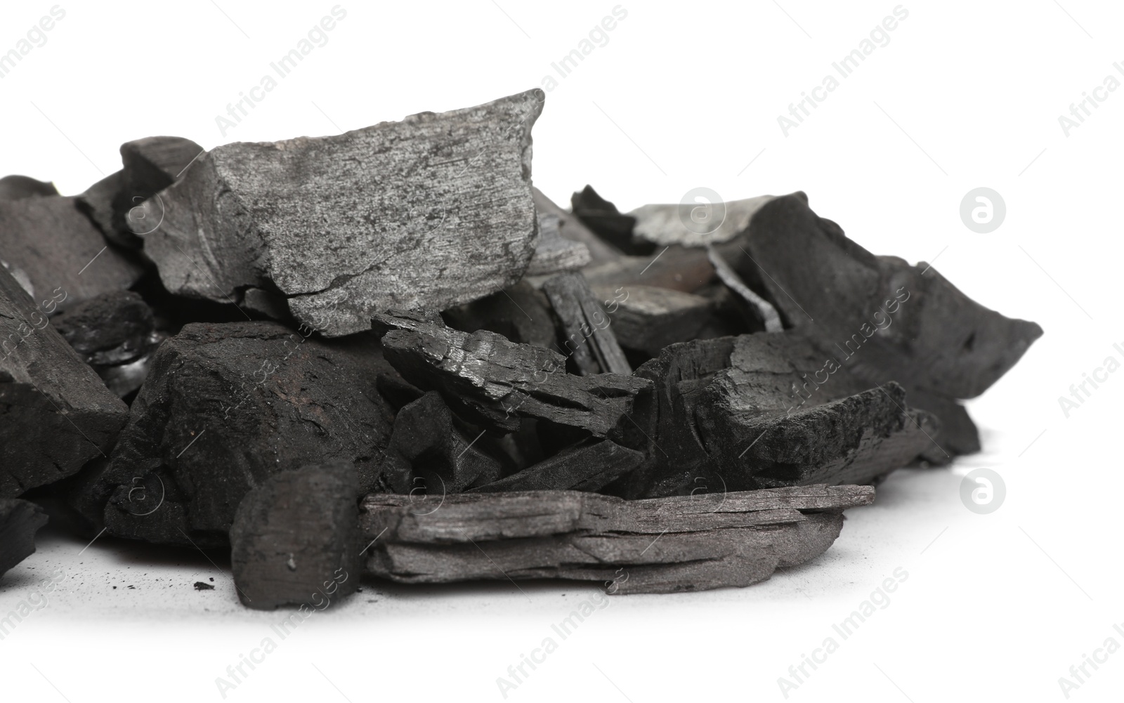 Pieces of black coals isolated on white Photo of Pieces of black coals isolated on white
