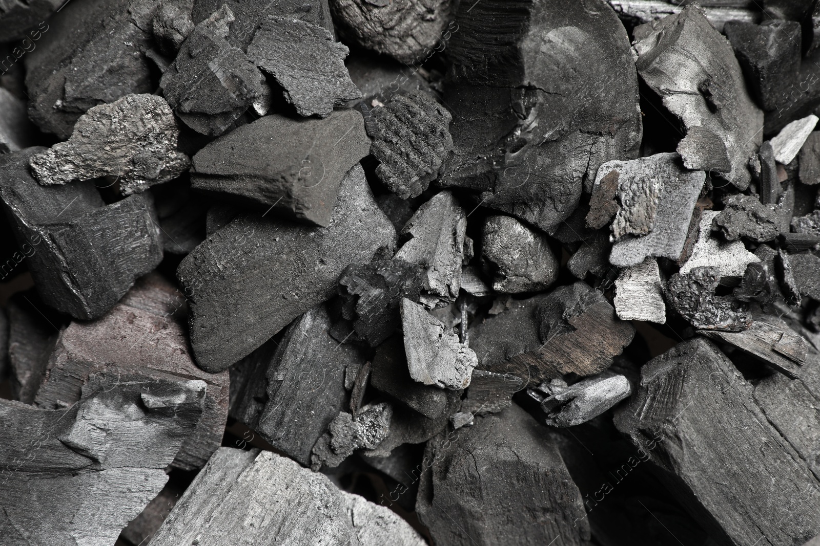 Pieces of black coals as background, top view Photo of Pieces of black coals as background, top view