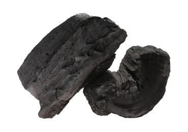 Photo of Pieces of black coals isolated on white