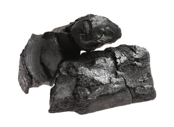 Photo of Pieces of black coals isolated on white
