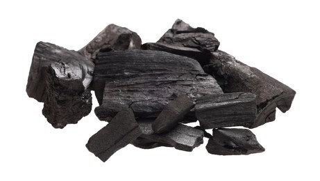 Photo of Pieces of black coals isolated on white