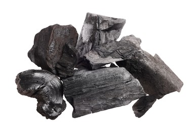 Photo of Pieces of black coals isolated on white, top view