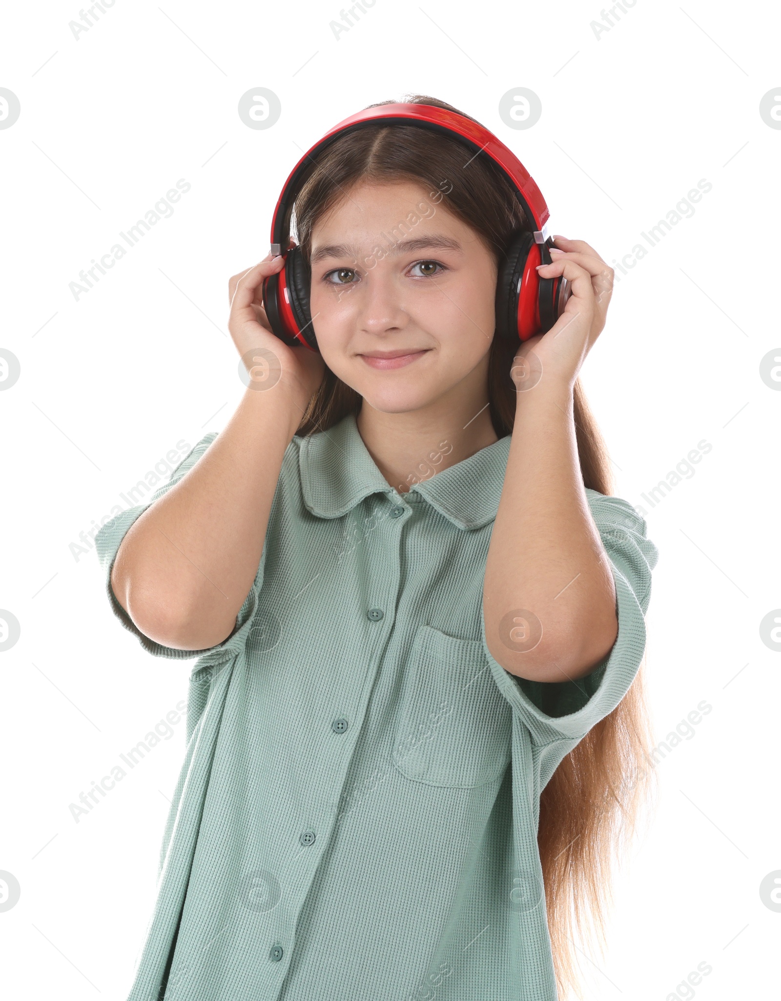 Teenage girl in headphones on white background Photo of Teenage girl in headphones on white background