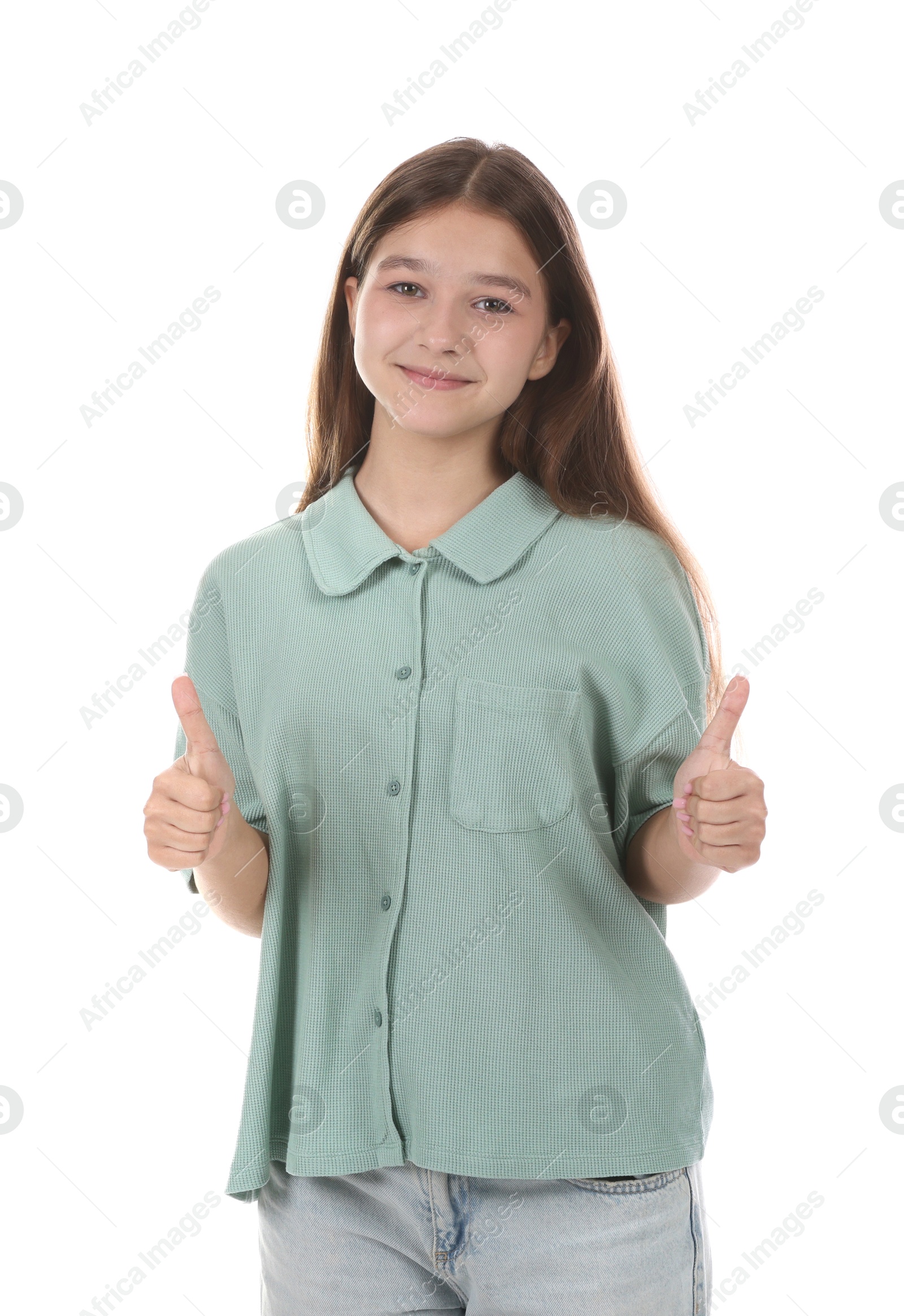 Teenage girl showing thumbs up on white background Photo of Teenage girl showing thumbs up on white background