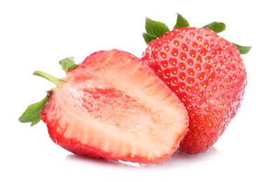 Photo of Whole and half of fresh strawberries isolated on white