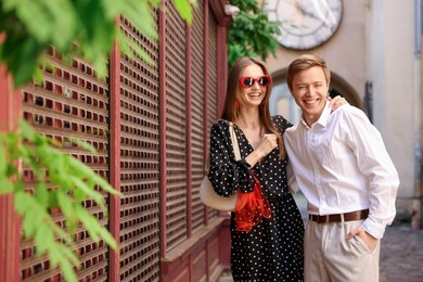 Photo of Lovely couple walking together on city street